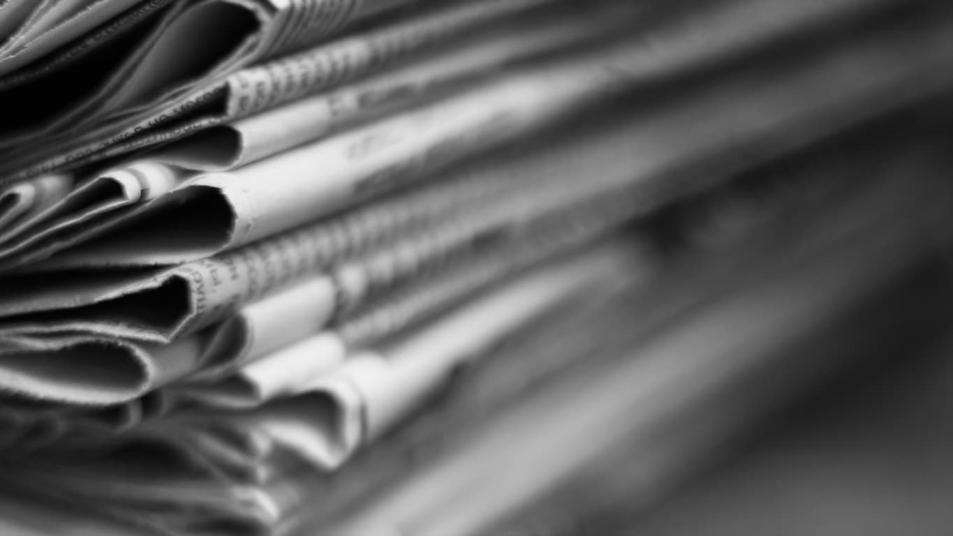 Newspapers stacked